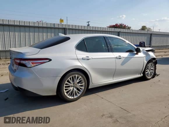 2019 Toyota Camry Hybrid LE с VIN 4T1B21HK2KU512025, выставлен на аукционе Copart как лот 80734415 с пробегом 106 463 миль миль и Списание • Salvage title. История ставок и продаж доступна на DreamBid. Изображение 3.