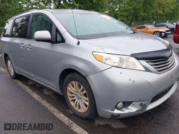 2014 Toyota Sienna XLE with VIN 5TDYK3DC4ES407634, listed as a IAAI auction lot 43034127 with 240,881 mi miles and . Bid and sale history available at DreamBid. Image 1.