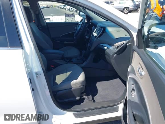 2016 Hyundai Santa Fe with VIN 5XYZU3LBXGG316388, listed as a IAAI auction lot 43215922 with 123,510 mi miles and . Bid and sale history available at DreamBid. Image 5.