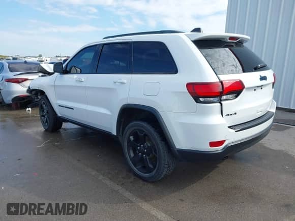 2018 Jeep Grand Cherokee Laredo E with VIN 1C4RJFAG1JC370361, listed as a IAAI auction lot 43284928 with 75,952 mi miles and . Bid and sale history available at DreamBid. Image 3.