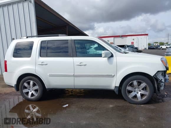 2013 Honda Pilot Touring with VIN 5FNYF4H95DB001891, listed as a IAAI auction lot 43335857 with 236,842 mi miles and . Bid and sale history available at DreamBid. Image 14.