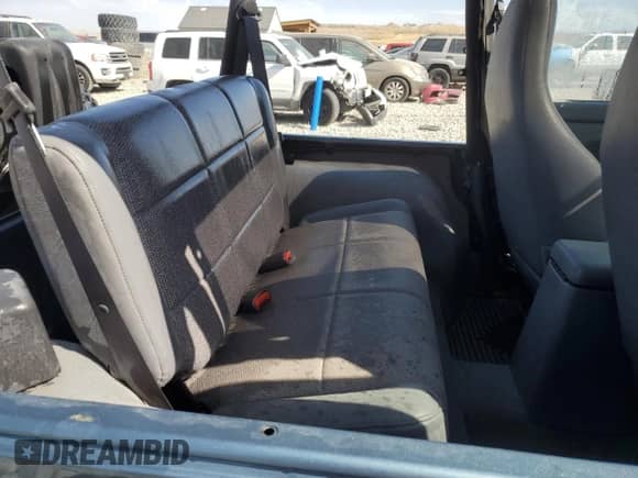 1998 Jeep Wrangler Sport z VIN 1J4FY19S5WP798597, wystawiony jako Copart lot #68707305 z przebiegiem Nie podano mil oraz Szkoda całkowita • Salvage title. Historia ofert i sprzedaży dostępna na DreamBid. Obrazek 10.