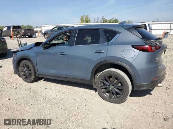 2023 Mazda CX-5 S Carbon Edition z VIN JM3KFBCM2P0137783, wystawiony jako Copart lot #81884955 z przebiegiem Nie podano mil oraz Nie do naprawy • Non repairable. Historia ofert i sprzedaży dostępna na DreamBid. Obrazek 2.