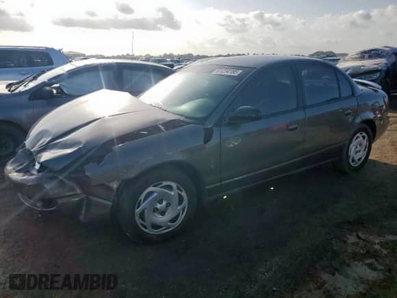 2000 Saturn SL with VIN 1G8ZK5278YZ160430, listed as a Copart auction lot 61234185 with 89,221 mi miles and Salvage title. Bid and sale history available at DreamBid. Image 1.