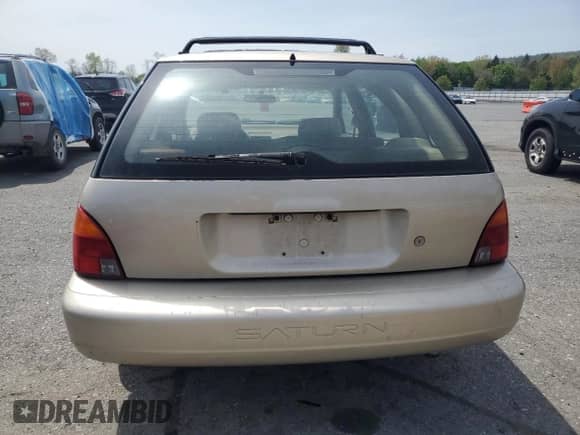 1999 Saturn SW with VIN 1G8ZJ827XXZ323713, listed as a Copart auction lot 55183385 with 166,834 mi miles and Salvage title. Bid and sale history available at DreamBid. Image 6.