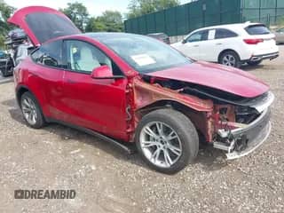 2022 Tesla Model Y Long Range z VIN 7SAYGAEE3NF484623, wystawiony jako IAAI lot #42982060 z przebiegiem 29 313 mil mil oraz . Historia ofert i sprzedaży dostępna na DreamBid. Obrazek 1.
