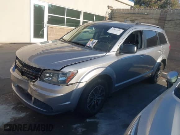 2017 Dodge Journey SE with VIN 3C4PDCAB8HT638368, listed as a IAAI auction lot 42915857 with 106,269 mi miles and . Bid and sale history available at DreamBid. Image 2.