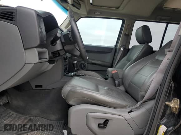 2006 Jeep Commander with VIN 1J8HH48N06C324424, listed as a Copart auction lot 89406105 with 207,170 mi miles and Salvage title. Bid and sale history available at DreamBid. Image 7.