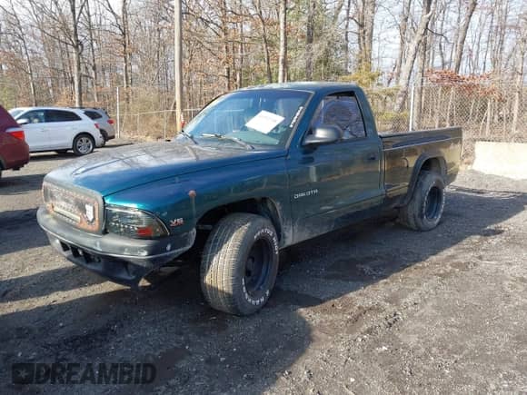 1999 Dodge Dakota SLT with VIN 1B7FL26X0XS208461, listed as a IAAI auction lot 41492338 with 185,400 mi miles and . Bid and sale history available at DreamBid. Image 2.