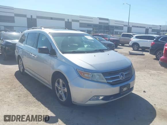 2012 Honda Odyssey Touring с VIN 5FNRL5H95CB122101, выставлен на аукционе IAAI как лот 43489117 с пробегом 154 148 миль миль и . История ставок и продаж доступна на DreamBid. Изображение 1.