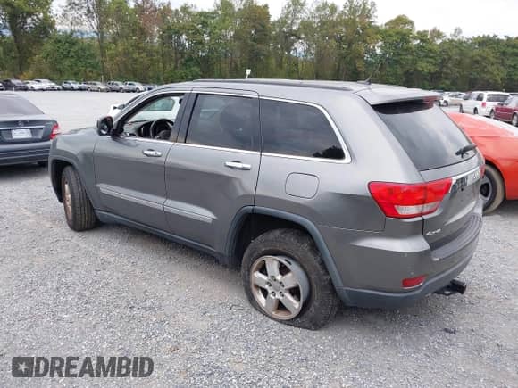 2012 Jeep Grand Cherokee Laredo with VIN 1C4RJFAG3CC272631, listed as a IAAI auction lot 43291923 with 168,220 mi miles and . Bid and sale history available at DreamBid. Image 3.