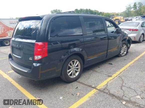 2014 Dodge Grand Caravan SXT with VIN 2C4RDGCG7ER291753, listed as a IAAI auction lot 43149467 with 111,617 mi miles and . Bid and sale history available at DreamBid. Image 4.