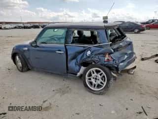 2010 MINI Hardtop S with VIN WMWMF7C51ATZ69061, listed as a Copart auction lot 60837465 with 102,506 mi miles and Salvage title. Bid and sale history available at DreamBid. Image 2.