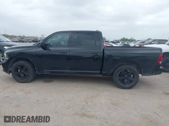 2014 Ram 1500 Tradesman with VIN 1C6RR6KTXES237296, listed as a IAAI auction lot 41950682 with 202,757 mi miles and . Bid and sale history available at DreamBid. Image 14.