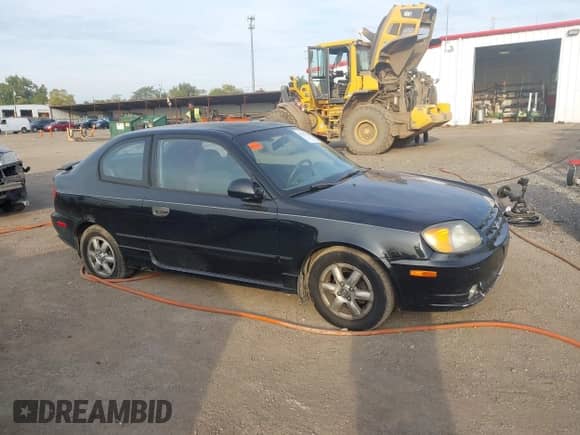 2005 Hyundai Accent GLS z VIN KMHCG35CX5U332441, wystawiony jako IAAI lot #43217479 z przebiegiem 225 254 mil mil oraz . Historia ofert i sprzedaży dostępna na DreamBid. Obrazek 13.