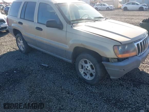 2000 Jeep Grand Cherokee Laredo z VIN 1J4GW48S0YC309210, wystawiony jako IAAI lot #43551821 z przebiegiem 324 070 mil mil oraz . Historia ofert i sprzedaży dostępna na DreamBid. Obrazek 1.