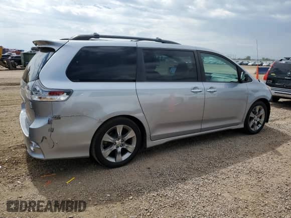 2014 Toyota Sienna SE with VIN 5TDXK3DC0ES412437, listed as a Copart auction lot 70558525 with 145,488 mi miles and Salvage title. Bid and sale history available at DreamBid. Image 3.