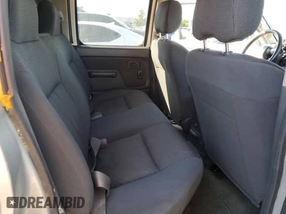 2004 Nissan Frontier XE with VIN 1N6ED29X24C429616, listed as a Copart auction lot 57605075 with 214,815 mi miles and Salvage title. Bid and sale history available at DreamBid. Image 10.