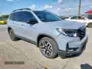 2022 Honda Passport Elite with VIN 5FNYF8H05NB025666, listed as a Copart auction lot 69301095 with 34,758 mi miles and Salvage title. Bid and sale history available at DreamBid. Image 4.