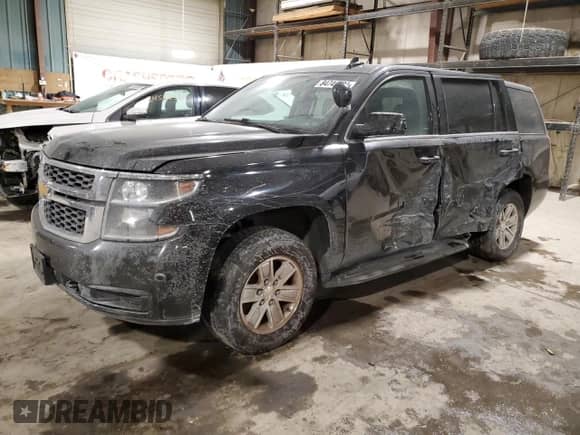 2015 Chevrolet Tahoe Commercial with VIN 1GNSK2EC4FR718793, listed as a Copart auction lot 84749724 with 122,342 mi miles and Salvage title. Bid and sale history available at DreamBid. Image 1.