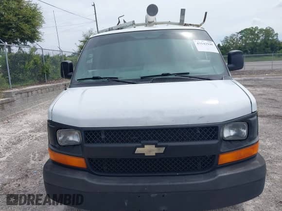 2014 Chevrolet Express Cargo with VIN 1GCSGAFX7E1182411, listed as a IAAI auction lot 43142948 with 248,561 mi miles and . Bid and sale history available at DreamBid. Image 12.
