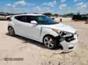2014 Hyundai Veloster z VIN KMHTC6ADXEU211730, wystawiony jako Copart lot #71236595 z przebiegiem 107 121 mil mil oraz Szkoda całkowita • Salvage title. Historia ofert i sprzedaży dostępna na DreamBid. Obrazek 4.