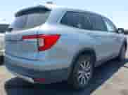 2020 Honda Pilot EX-L with VIN 5FNYF5H54LB015931, listed as a IAAI auction lot 42643916 with 54,617 mi miles and . Bid and sale history available at DreamBid. Image 4.