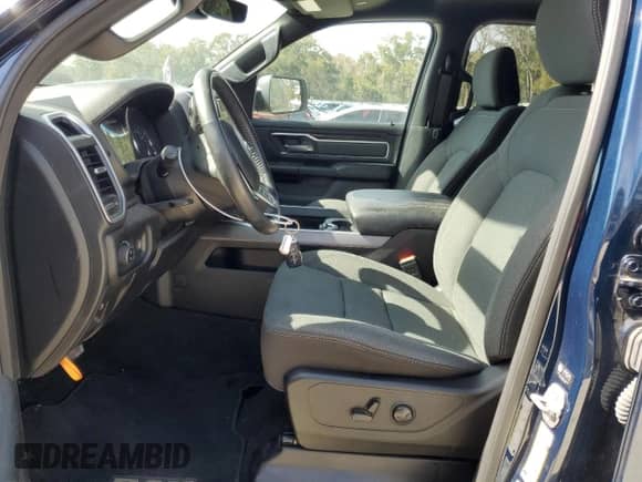 2023 Ram 1500 Big Horn with VIN 1C6SRFMT7PN556509, listed as a Copart auction lot 42938185 with 18,049 mi miles and Salvage title. Bid and sale history available at DreamBid. Image 7.