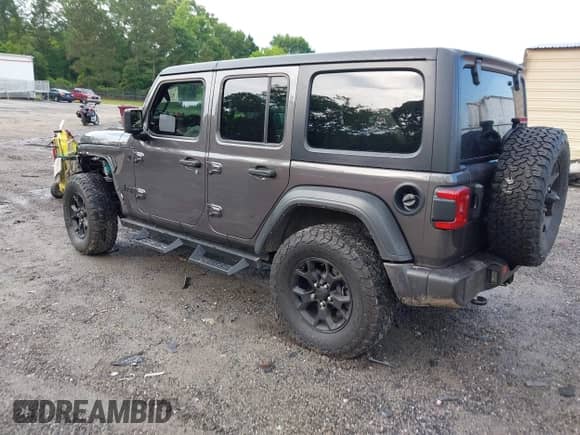 2021 Jeep Wrangler Unlimited Willys with VIN 1C4HJXDG2MW646904, listed as a IAAI auction lot 42267506 with 55,530 mi miles and . Bid and sale history available at DreamBid. Image 3.