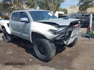 2019 Toyota Tacoma SR5 with VIN 3TMAZ5CN3KM104450, listed as a IAAI auction lot 43054667 with 124,554 mi miles and . Bid and sale history available at DreamBid. Image 1.
