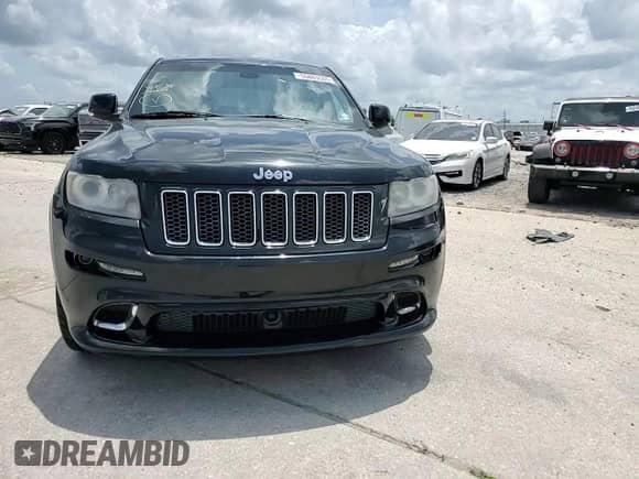 2012 Jeep Grand Cherokee SRT-8 z VIN 1C4RJFDJ7CC211421, wystawiony jako Copart lot #55883505 z przebiegiem 96 877 mil mil oraz Szkoda całkowita • Salvage title. Historia ofert i sprzedaży dostępna na DreamBid. Obrazek 14.