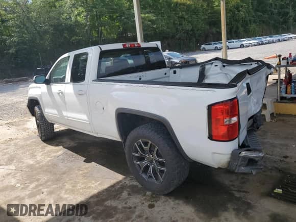 2014 GMC Sierra 1500 SLE with VIN 1GTR1UEC7EZ232676, listed as a Copart auction lot 64230215 with 142,117 mi miles and Salvage title. Bid and sale history available at DreamBid. Image 2.