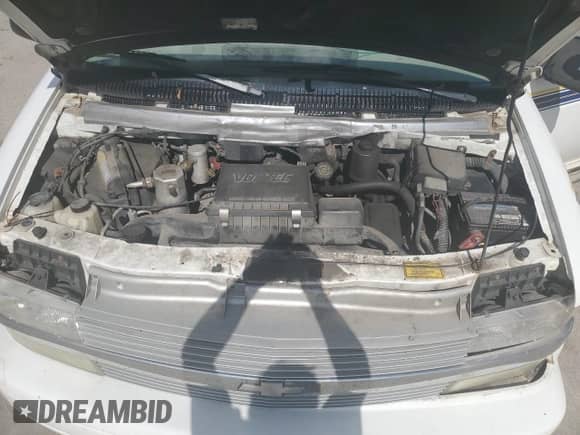 2000 Chevrolet Astro z VIN 1GNEL19W6YB179002, wystawiony jako Copart lot #75519494 z przebiegiem 170 331 mil mil oraz Szkoda całkowita • Salvage title. Historia ofert i sprzedaży dostępna na DreamBid. Obrazek 13.