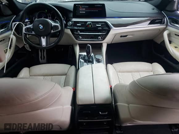 2018 BMW 5 Series M550i xDrive with VIN WBAJB9C54JB035699, listed as a Copart auction lot 71395105 with 94,373 mi miles and Salvage title. Bid and sale history available at DreamBid. Image 8.