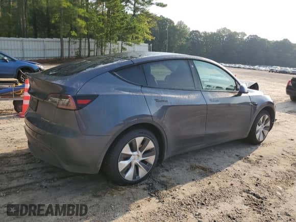 2023 Tesla Model Y Long Range with VIN 7SAYGAEE4PF668889, listed as a Copart auction lot 67239314 with 26,874 mi miles and Salvage title. Bid and sale history available at DreamBid. Image 3.