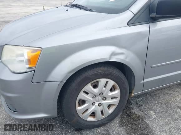 2013 Dodge Grand Caravan American Value with VIN 2C4RDGBG0DR807449, listed as a IAAI auction lot 43262185 with 137,280 mi miles and . Bid and sale history available at DreamBid. Image 12.