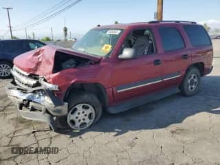 2004 Chevrolet Tahoe LS with VIN 1GNEC13T44R294049, listed as a Copart auction lot 59900565 with 149,379 mi miles and Salvage title. Bid and sale history available at DreamBid. Image 1.