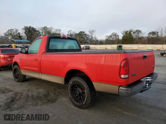 2001 Ford F-150 XL z VIN 2FTRF17W21CB04408, wystawiony jako Copart lot #79872124 z przebiegiem 82 773 mil mil oraz Szkoda całkowita • Salvage title. Historia ofert i sprzedaży dostępna na DreamBid. Obrazek 2.
