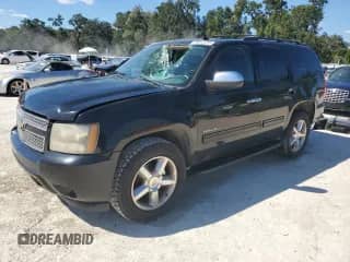 2011 Chevrolet Tahoe LS with VIN 1GNSCAE01BR179105, listed as a Copart auction lot 86249295 with 233,418 mi miles and Salvage title. Bid and sale history available at DreamBid. Image 1.