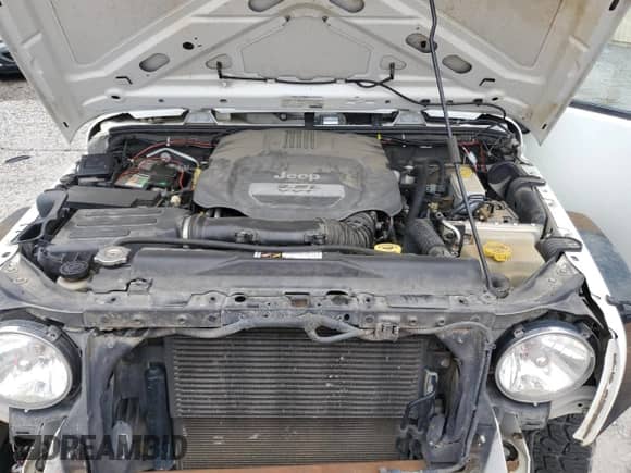 2013 Jeep Wrangler Sport with VIN 1C4AJWAG2DL512251, listed as a Copart auction lot 68094295 with 153,366 mi miles and Salvage title. Bid and sale history available at DreamBid. Image 11.