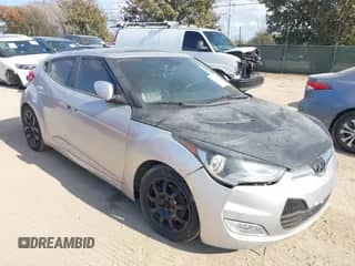 2012 Hyundai Veloster w/Gray Int z VIN KMHTC6AD0CU068400, wystawiony jako IAAI lot #41493521 z przebiegiem 72 682 mil mil oraz . Historia ofert i sprzedaży dostępna na DreamBid. Obrazek 1.