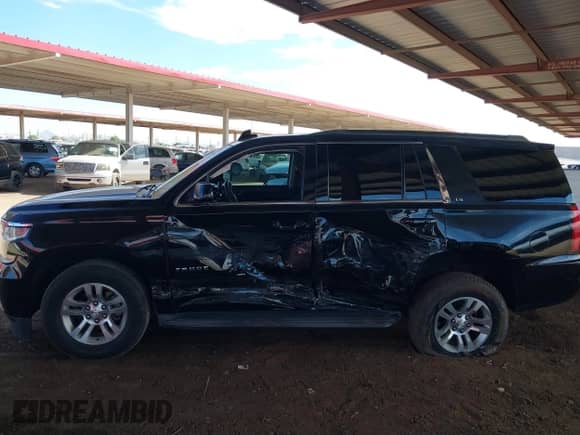 2015 Chevrolet Tahoe LS with VIN 1GNSCAKC0FR711917, listed as a IAAI auction lot 43241350 with 181,124 mi miles and . Bid and sale history available at DreamBid. Image 14.