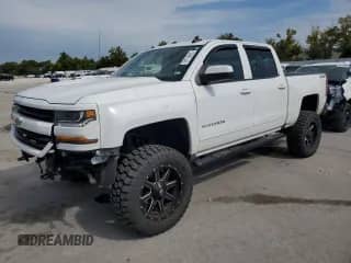 2018 Chevrolet Silverado 1500 LT z VIN 3GCUKREC7JG484152, wystawiony jako Copart lot #71714215 z przebiegiem 158 596 mil mil oraz Szkoda całkowita • Salvage title. Historia ofert i sprzedaży dostępna na DreamBid. Obrazek 1.