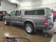 2003 Dodge Dakota Sport с VIN 1D7HL38N13S105320, выставлен на аукционе Copart как лот 84075524 с пробегом 159 708 миль миль и На запчасти • Non repairable. История ставок и продаж доступна на DreamBid. Изображение 2.