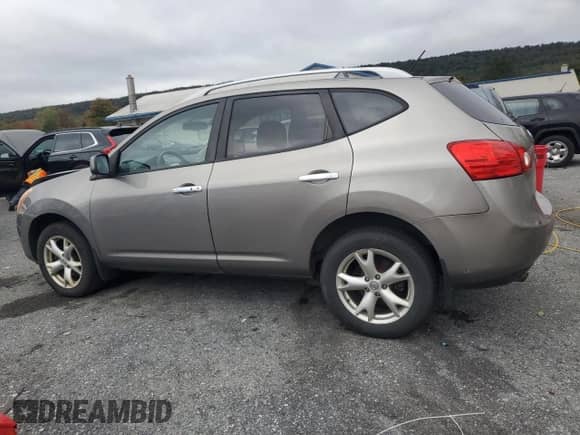 2010 Nissan Rogue S z VIN JN8AS5MVXAW601159, wystawiony jako Copart lot #86510585 z przebiegiem 205 297 mil mil oraz Szkoda całkowita • Salvage title. Historia ofert i sprzedaży dostępna na DreamBid. Obrazek 2.