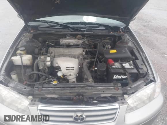 2000 Toyota Camry LE z VIN JT2BG22KXY0418018, wystawiony jako IAAI lot #43381609 z przebiegiem 169 958 mil mil oraz . Historia ofert i sprzedaży dostępna na DreamBid. Obrazek 10.