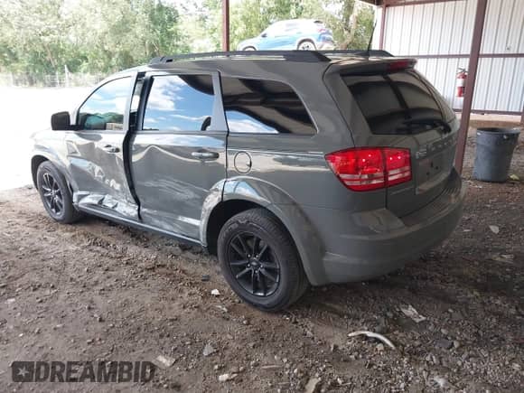 2020 Dodge Journey SE Value with VIN 3C4PDCABXLT259669, listed as a IAAI auction lot 42995598 with 98,957 mi miles and . Bid and sale history available at DreamBid. Image 3.