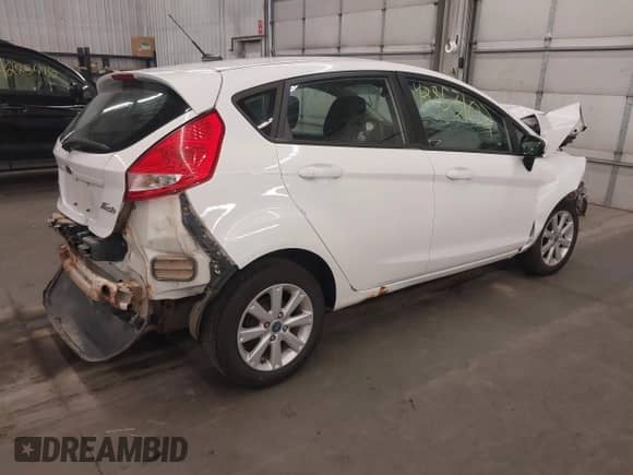 2012 Ford Fiesta SE with VIN 3FADP4EJ8CM180163, listed as a IAAI auction lot 42853102 with Not provided miles and . Bid and sale history available at DreamBid. Image 4.