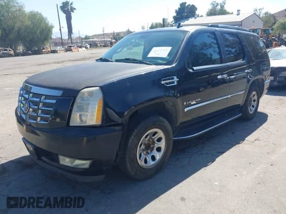2007 Cadillac Escalade z VIN 1GYEC63887R281627, wystawiony jako IAAI lot #42312945 z przebiegiem Nie podano mil oraz . Historia ofert i sprzedaży dostępna na DreamBid. Obrazek 17.