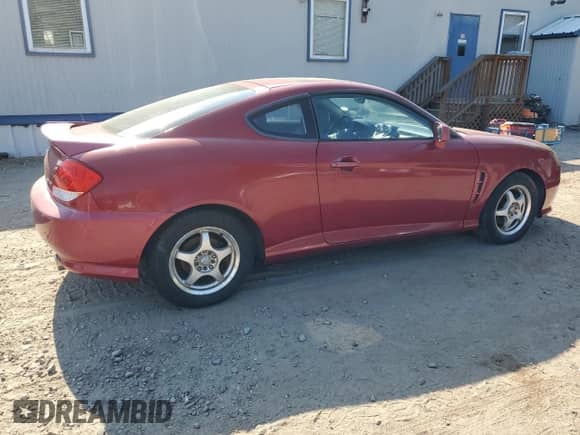 2006 Hyundai Tiburon GT с VIN KMHHN65F06U204556, выставлен на аукционе Copart как лот 82749974 с пробегом 95 270 миль миль и На запчасти • Non repairable. История ставок и продаж доступна на DreamBid. Изображение 3.